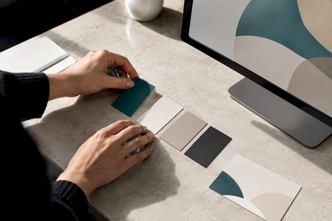 Designer arranging brand colour swatches
