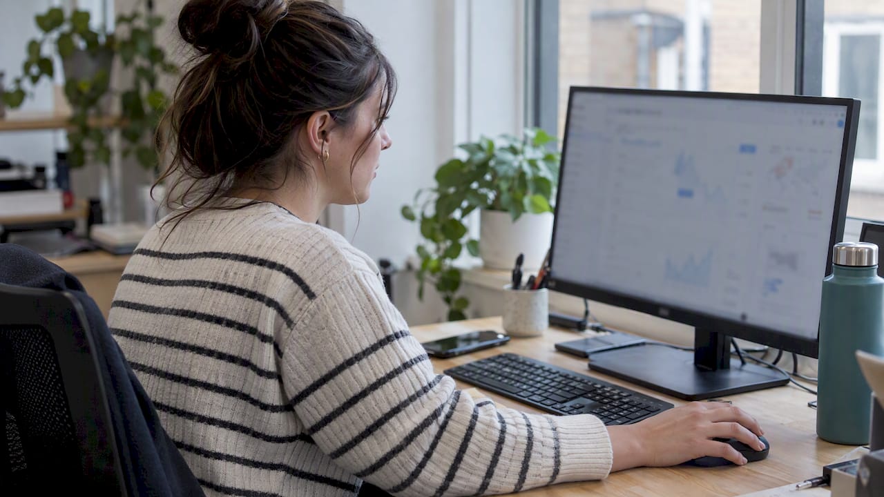 Analyst reviewing a Looker Studio dashboard